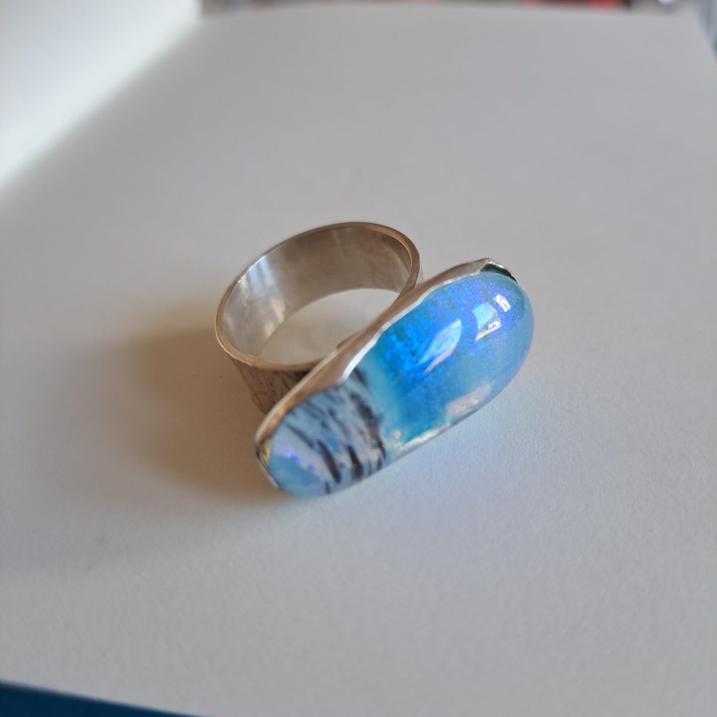 Pale blue and black dichroic fused glass and silver ring