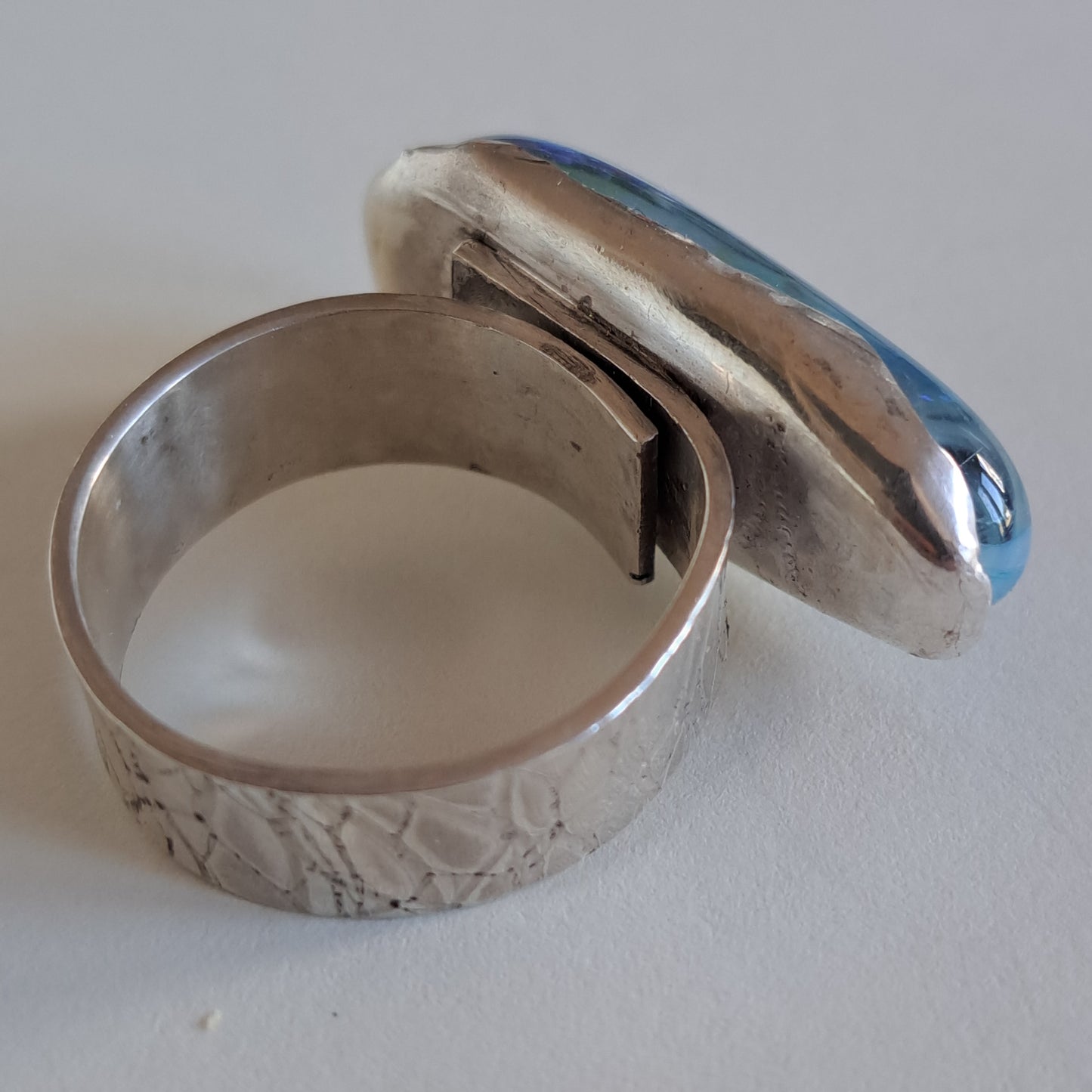 Pale blue and black dichroic fused glass and silver ring