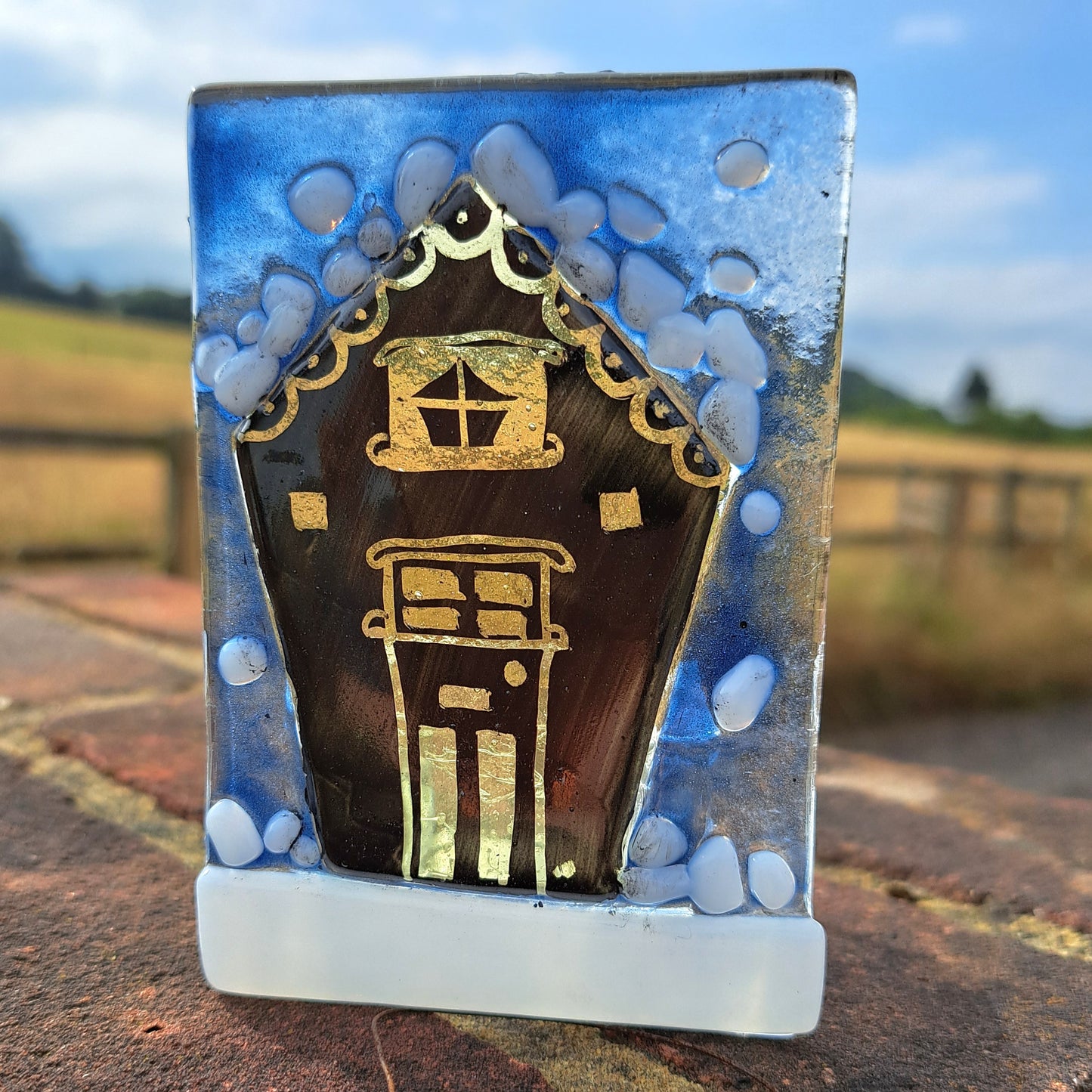 Single glowing house tealight holder