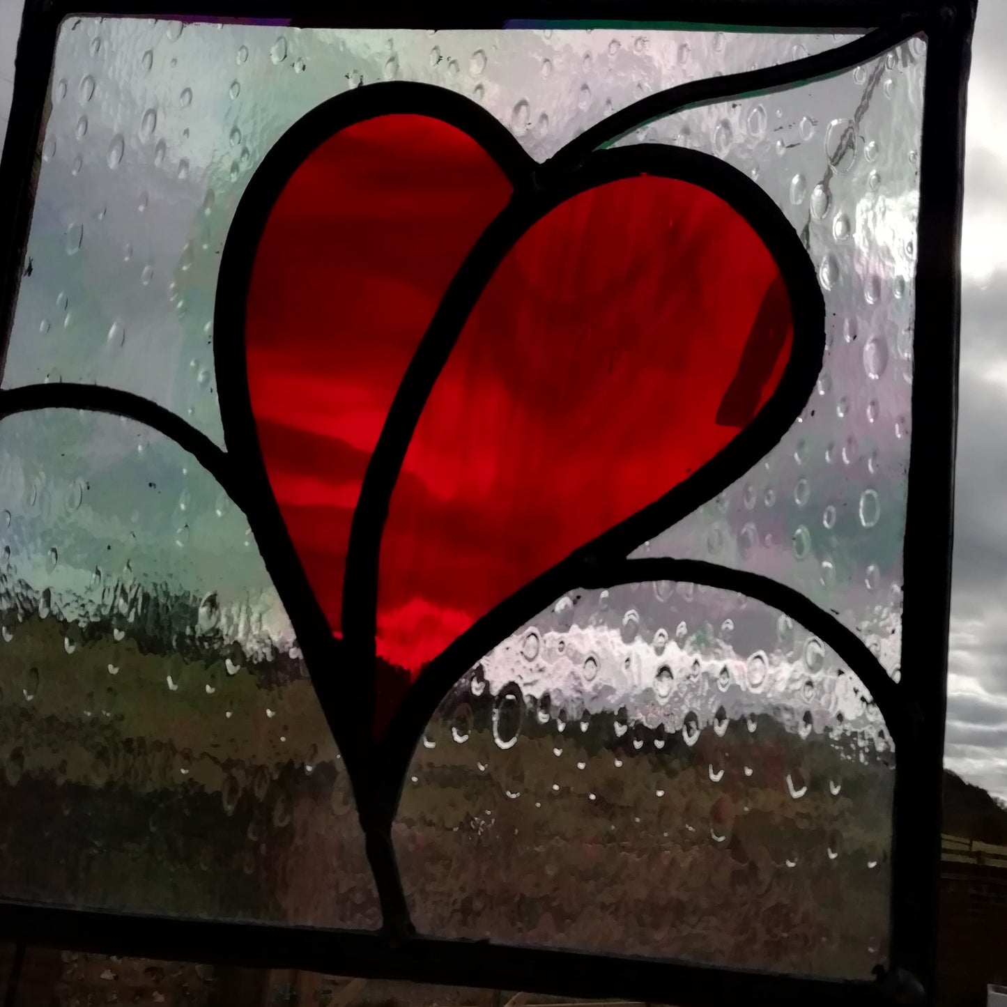 Stained glass heart panel